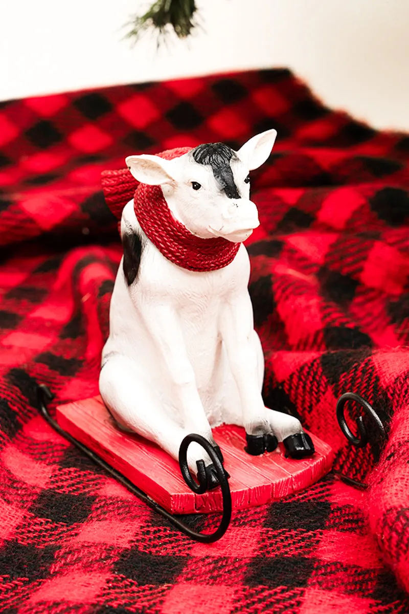 5.5 x 6 Snow Day Sledding Cow Resin Figurine