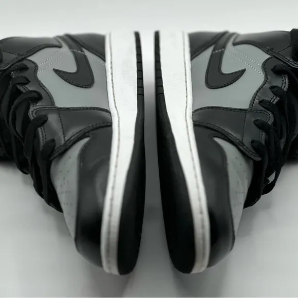 Black and Gray Sneakers with Red Accents