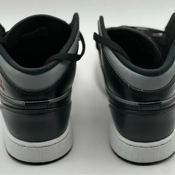 Black and Gray Sneakers with Red Accents