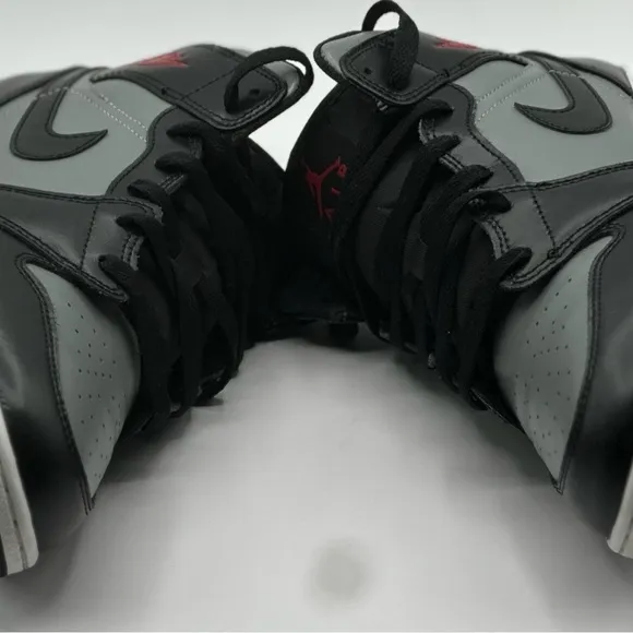 Black and Gray Sneakers with Red Accents